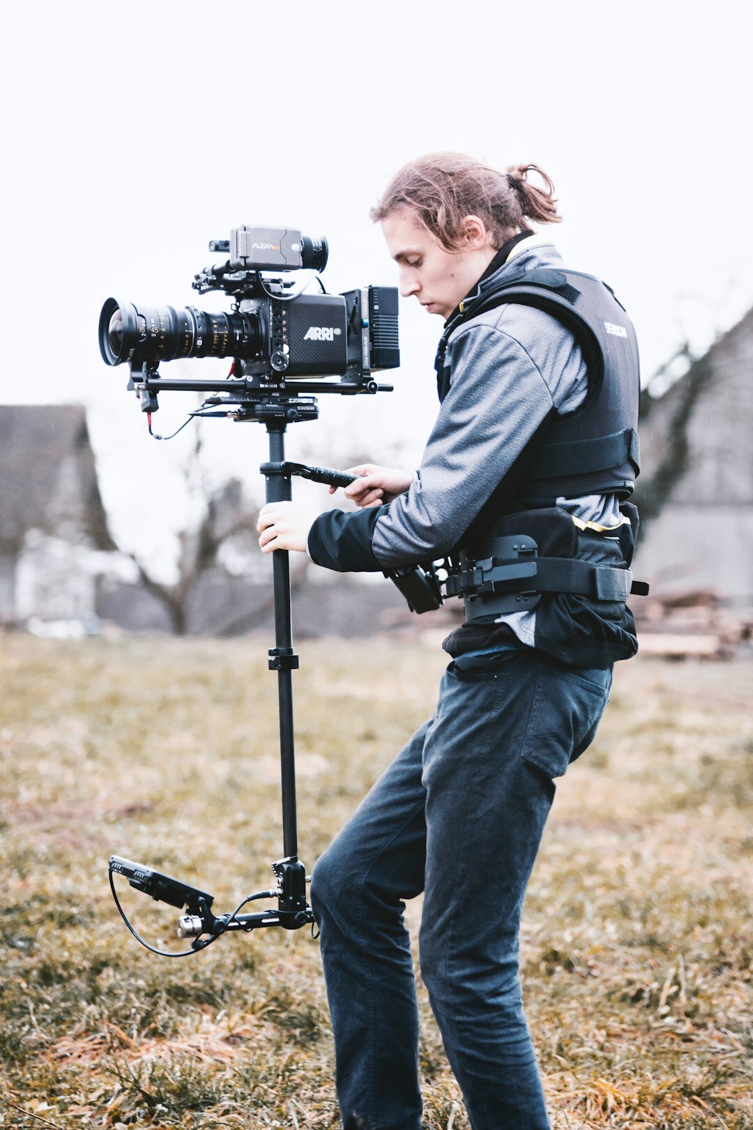 Belgian woman camera operator filming outdoors with a shoulder rig